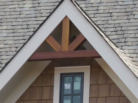Gable Bracket 40T96 with a w idth across the bottom of 96" is handcrafted from several Western Red Cedar Timbers. . Cedar gable brackets
